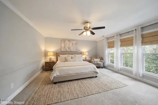 a view of an empty room with a ceiling fan and a window