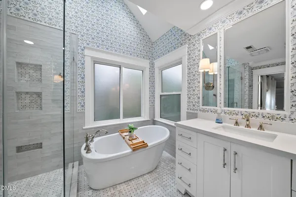 a bathroom with a sink a toilet and shower curtain