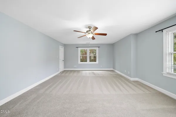 a view of a kitchen with furniture and staircase