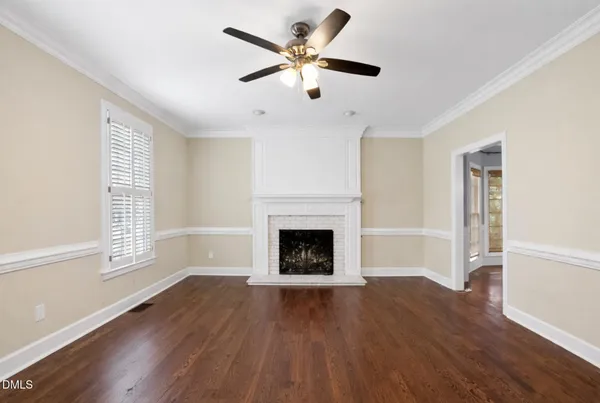 a kitchen with stainless steel appliances granite countertop a sink dishwasher a refrigerator a stove oven a sink with island and chairs