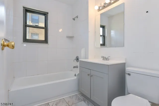 a bathroom with a sink toilet and bathtub