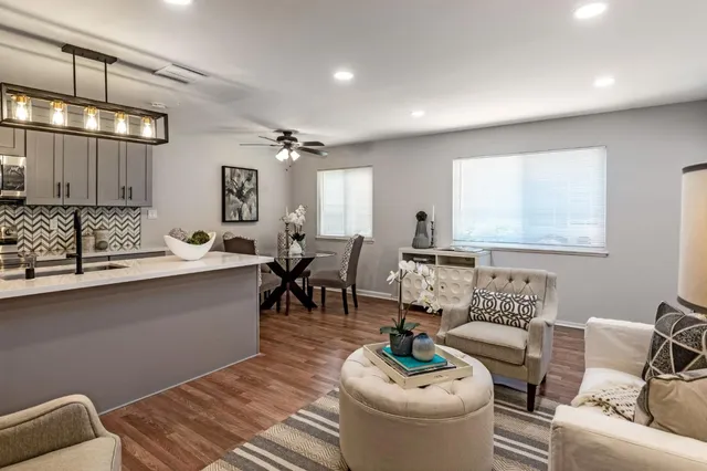 a living room with furniture and a large window