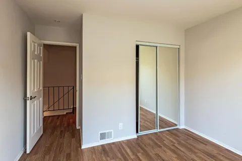 a view of front door with wooden floor
