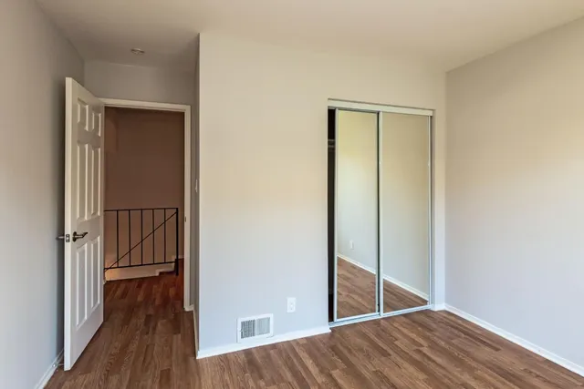 a view of front door with wooden floor