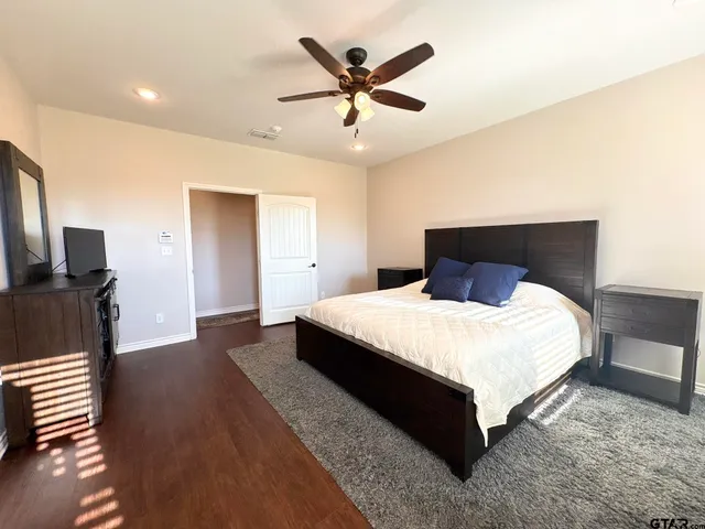 a view of hallway with wooden floor