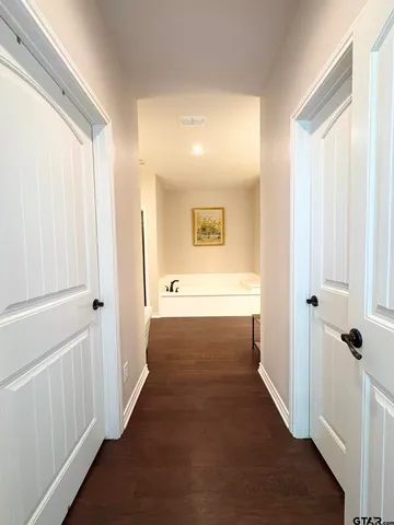 a view of a hallway with windows