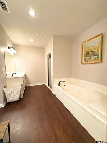 a bedroom with bed and window