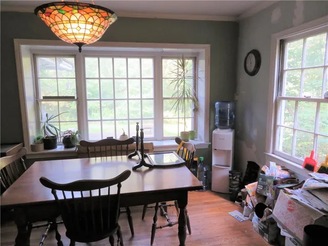 a view of a dining room with furniture window and outside view