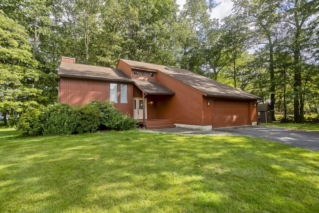 27 Bunker Circle East Longmeadow, MA 01028 - Photo 1 of 36 a backyard of a house with lots of green space