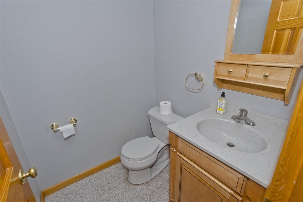 27 Bunker Circle East Longmeadow, MA 01028 - Photo 11 of 36 a bathroom with a sink mirror vanity and toilet
