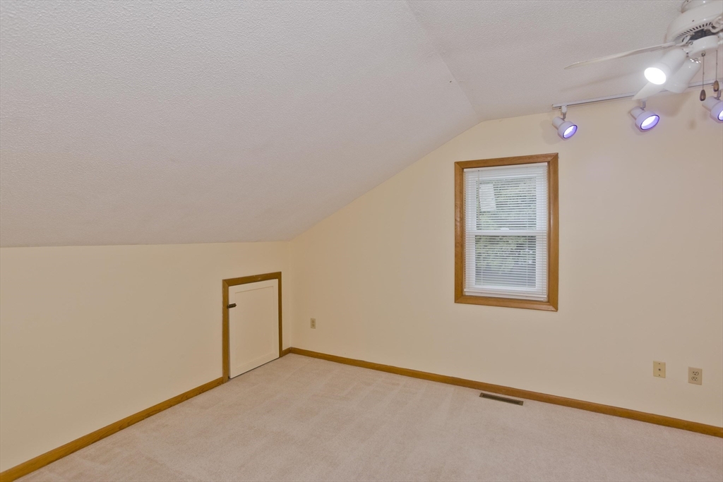27 Bunker Circle East Longmeadow, MA 01028 - Photo 22 of 36 an empty room with a workbench