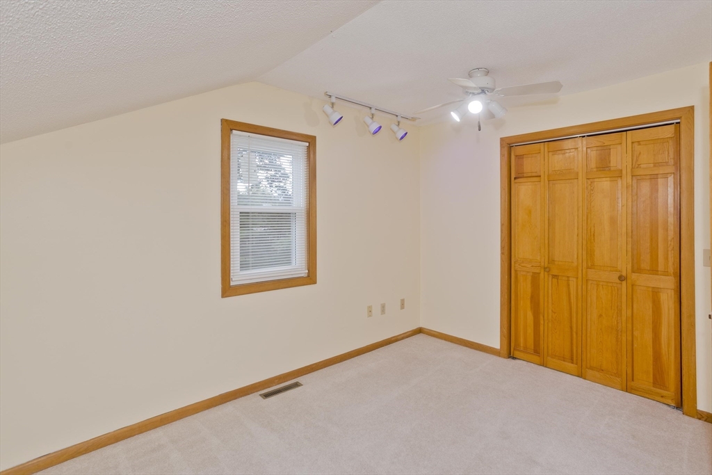 27 Bunker Circle East Longmeadow, MA 01028 - Photo 23 of 36 a view of an empty room with a window