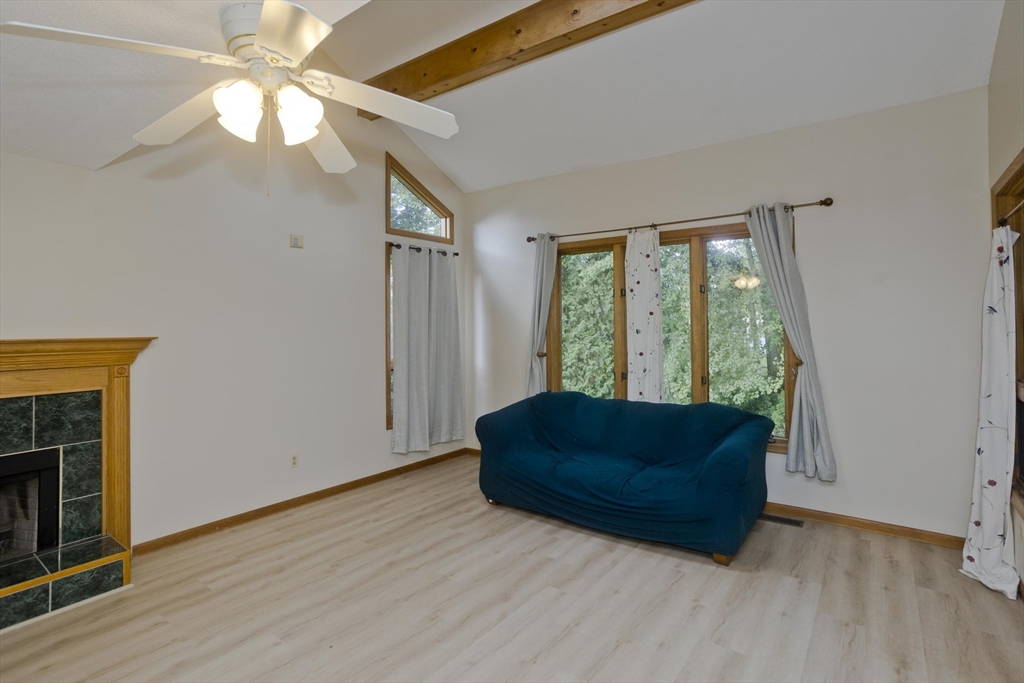 27 Bunker Circle East Longmeadow, MA 01028 - Photo 4 of 36 a living room with furniture and a fireplace