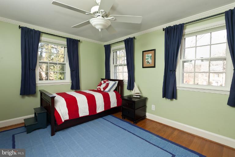 5430 Springlake Way Baltimore, MD 21212 - Photo 3 of 30 a bed sitting in a bedroom next to a window