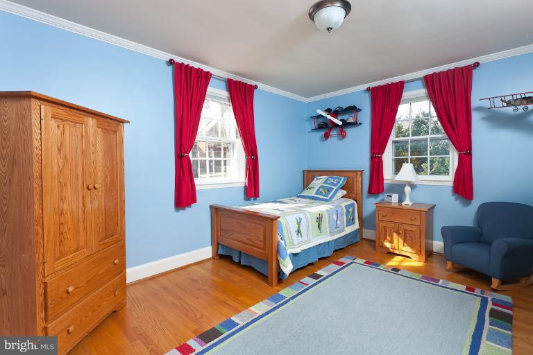 5430 Springlake Way Baltimore, MD 21212 - Photo 8 of 30 a bedroom with a bed and window