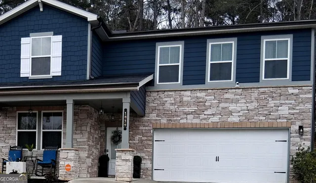 a front view of a house with glass windows