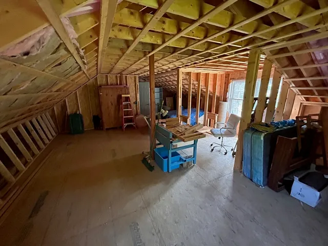 a outdoor space with a large window and furniture