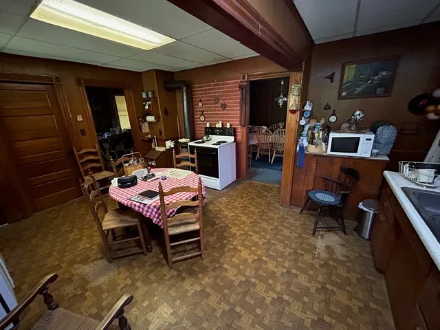 a dining room with furniture and window