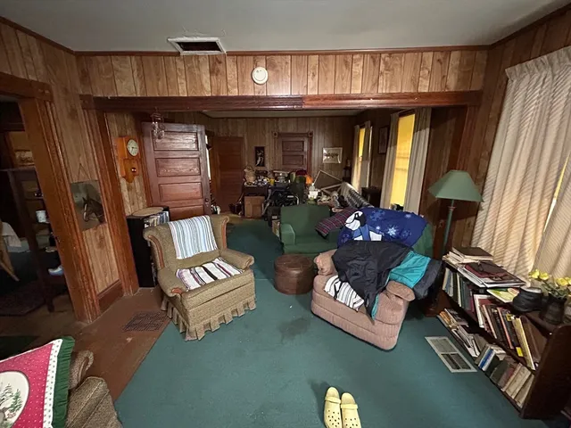 a living room with lots of furniture and a fireplace