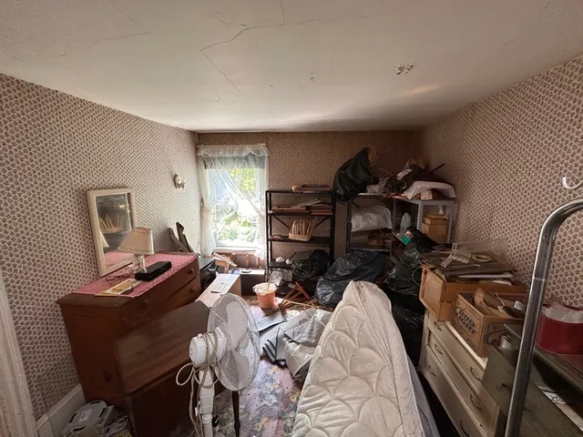 a bed room with a bed and a couch