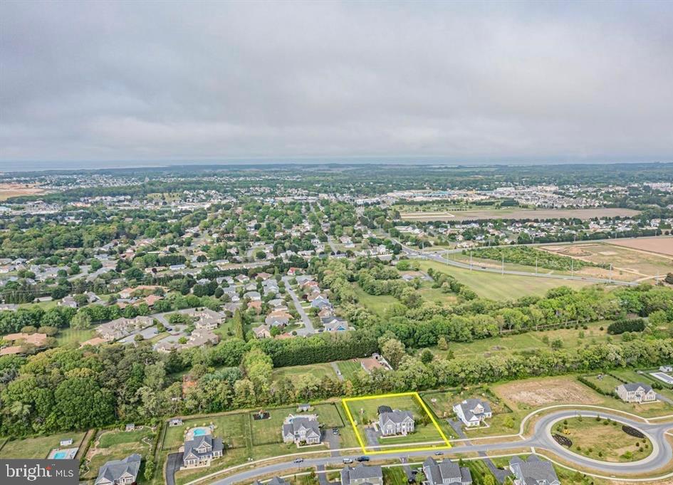 36932 Grove Estate Road Lewes, DE 19958 - Photo 104 of 105 an aerial view of residential houses with outdoor space