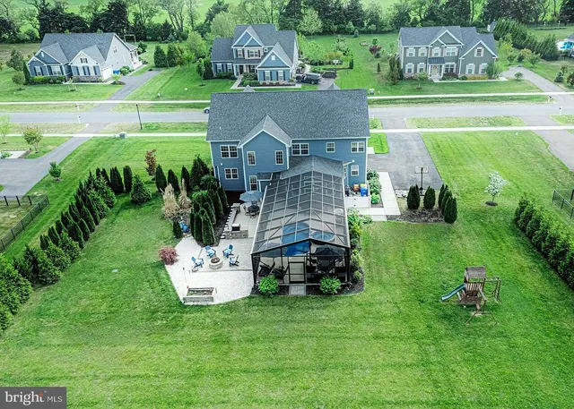 a view of a kitchen with granite countertop a sink and a stove