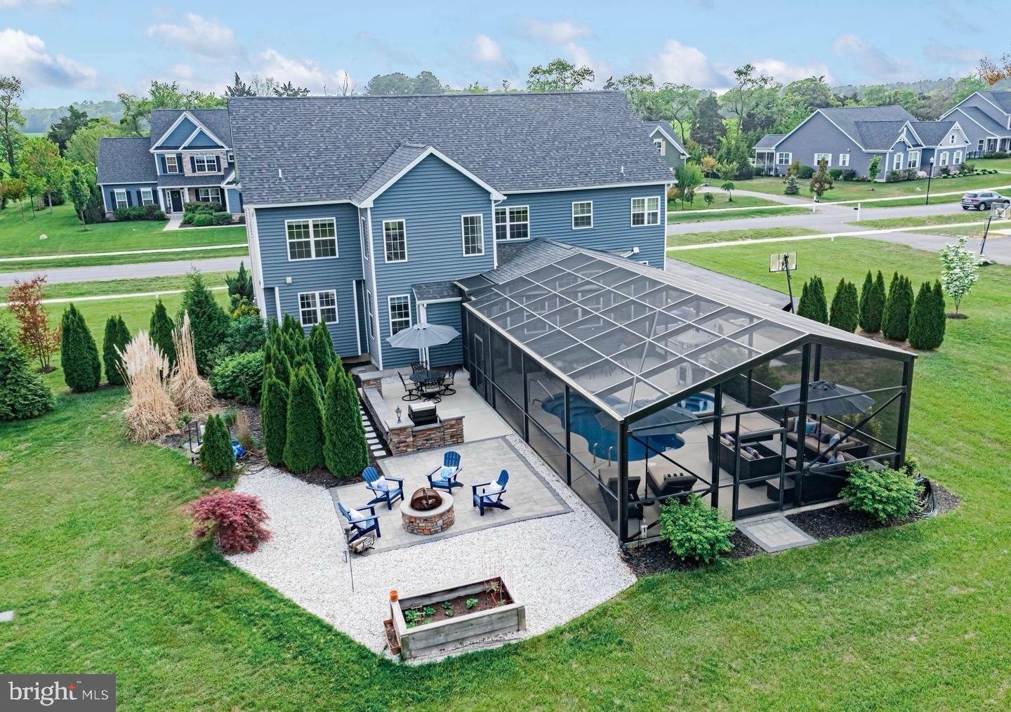 36932 Grove Estate Road Lewes, DE 19958 - Photo 12 of 105 a view of a house with a patio and a yard