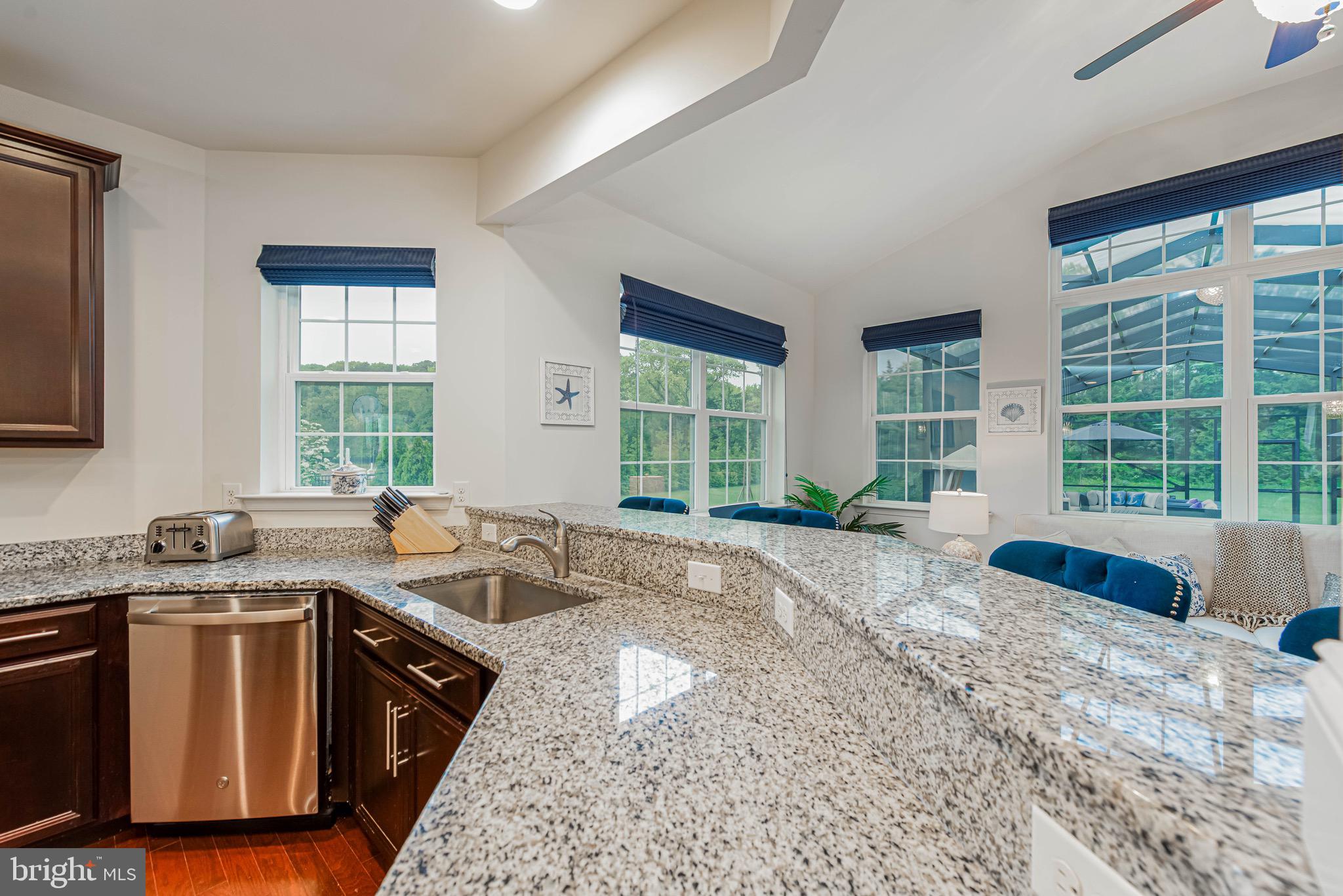 36932 Grove Estate Road Lewes, DE 19958 - Photo 47 of 105 a view of a kitchen with granite countertop a sink and a stove