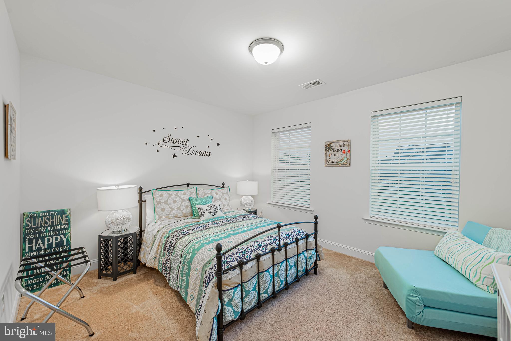 36932 Grove Estate Road Lewes, DE 19958 - Photo 57 of 105 a bedroom with a bed and a couch