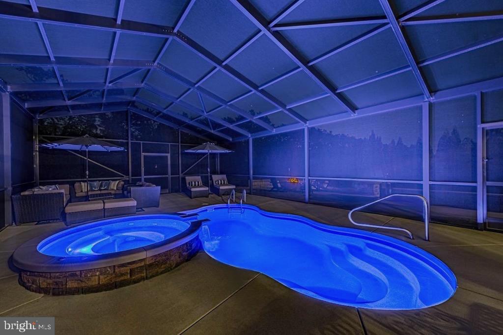 36932 Grove Estate Road Lewes, DE 19958 - Photo 97 of 105 a room with pool table and glass windows