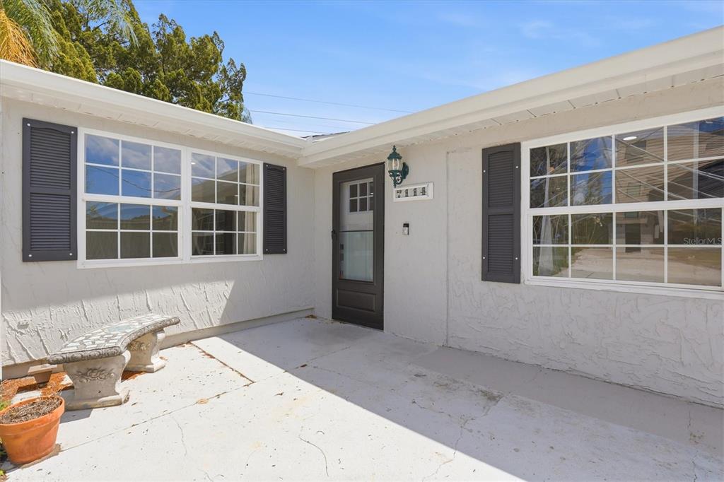 7114 Fair Lane Hudson, FL 34667 - Photo 12 of 59 a front view of a house with a yard