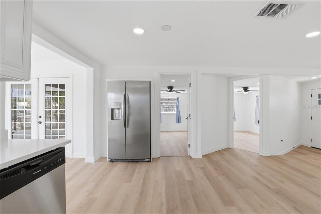 7114 Fair Lane Hudson, FL 34667 - Photo 23 of 59 a view of an empty room with wooden floor and a window