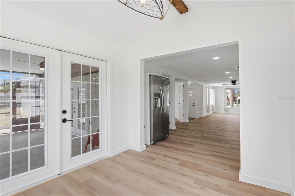 7114 Fair Lane Hudson, FL 34667 - Photo 26 of 59 a view of a hallway with wooden floor and windows