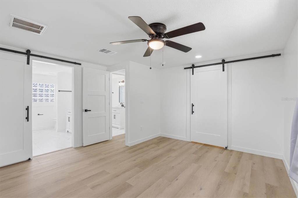 7114 Fair Lane Hudson, FL 34667 - Photo 29 of 59 a view of a big room with wooden floor closet and windows