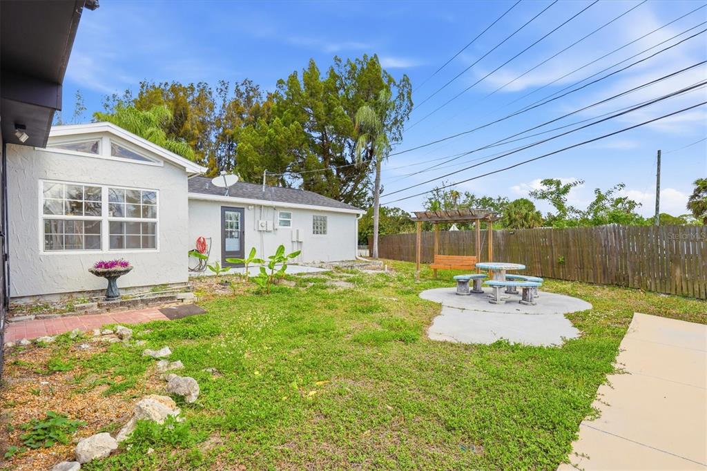 7114 Fair Lane Hudson, FL 34667 - Photo 49 of 59 a view of a house with backyard and sitting area