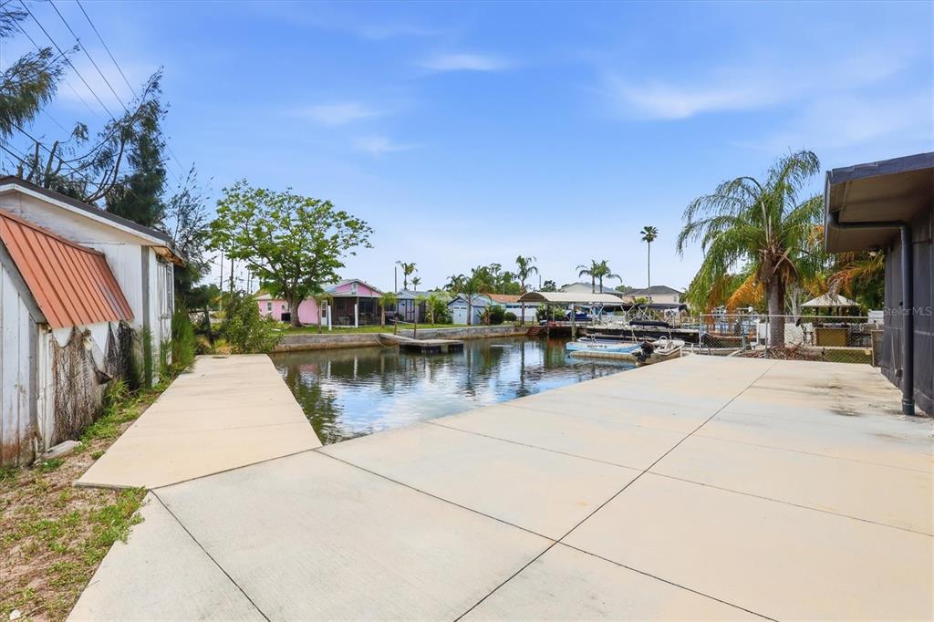 7114 Fair Lane Hudson, FL 34667 - Photo 50 of 59 a view of swimming pool with outdoor seating and plants