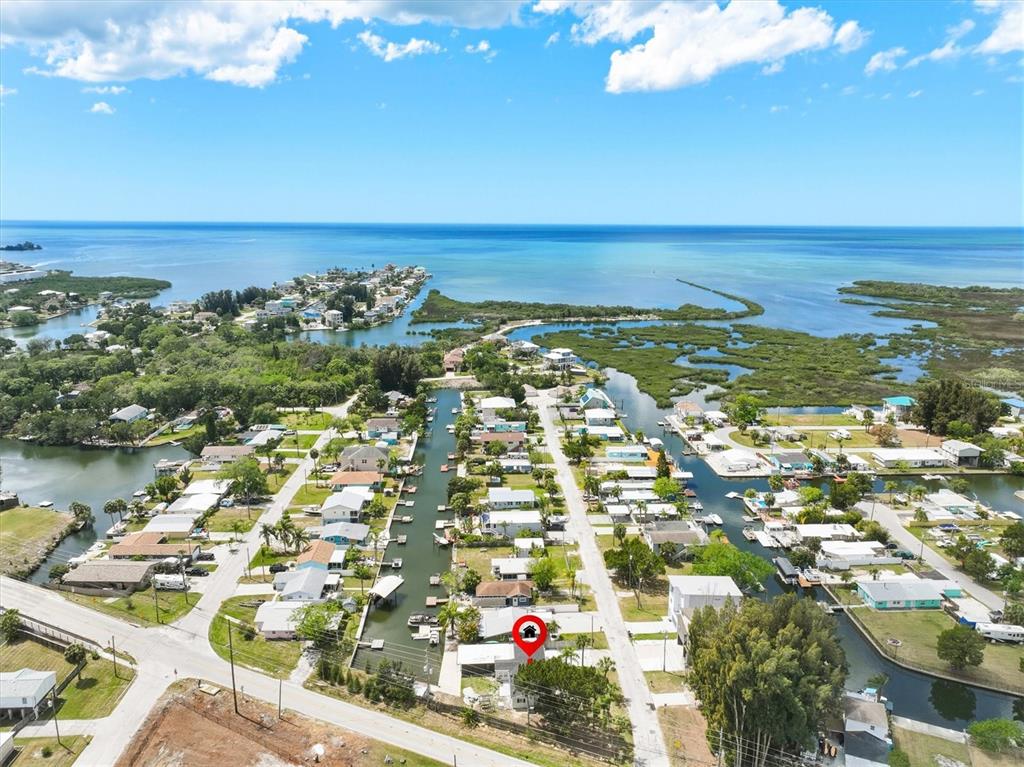 7114 Fair Lane Hudson, FL 34667 - Photo 5 of 59 an aerial view of residential building and lake