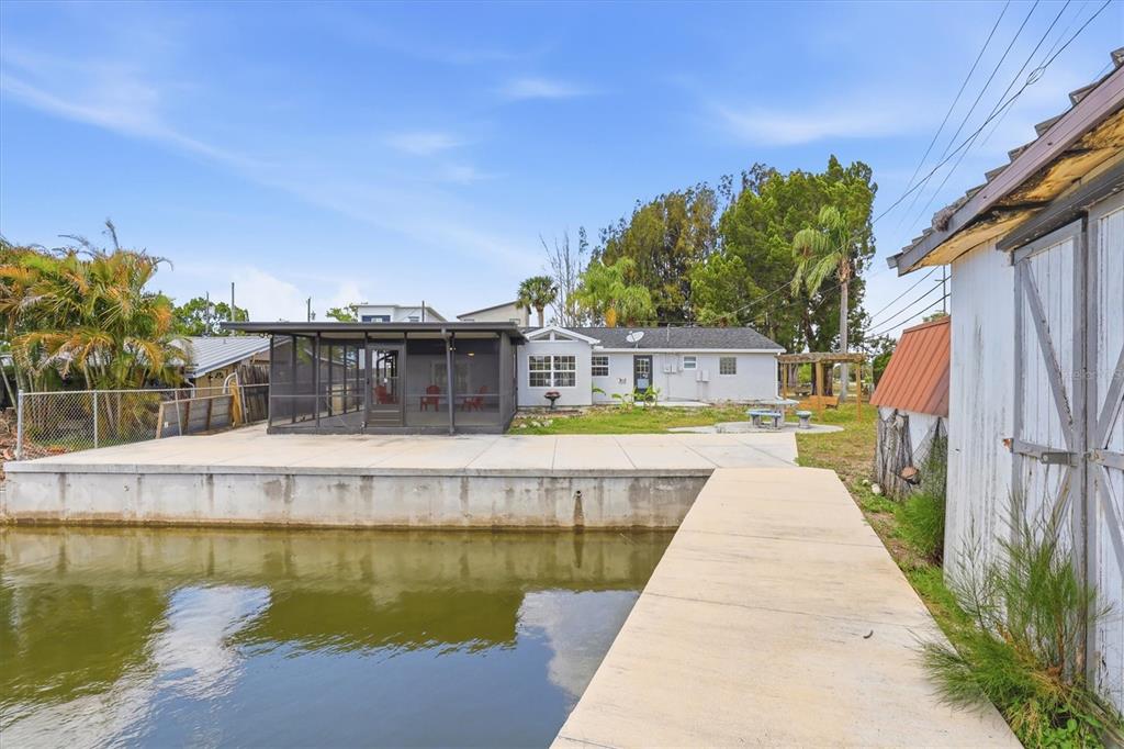 7114 Fair Lane Hudson, FL 34667 - Photo 51 of 59 a house with swimming pool in front of it