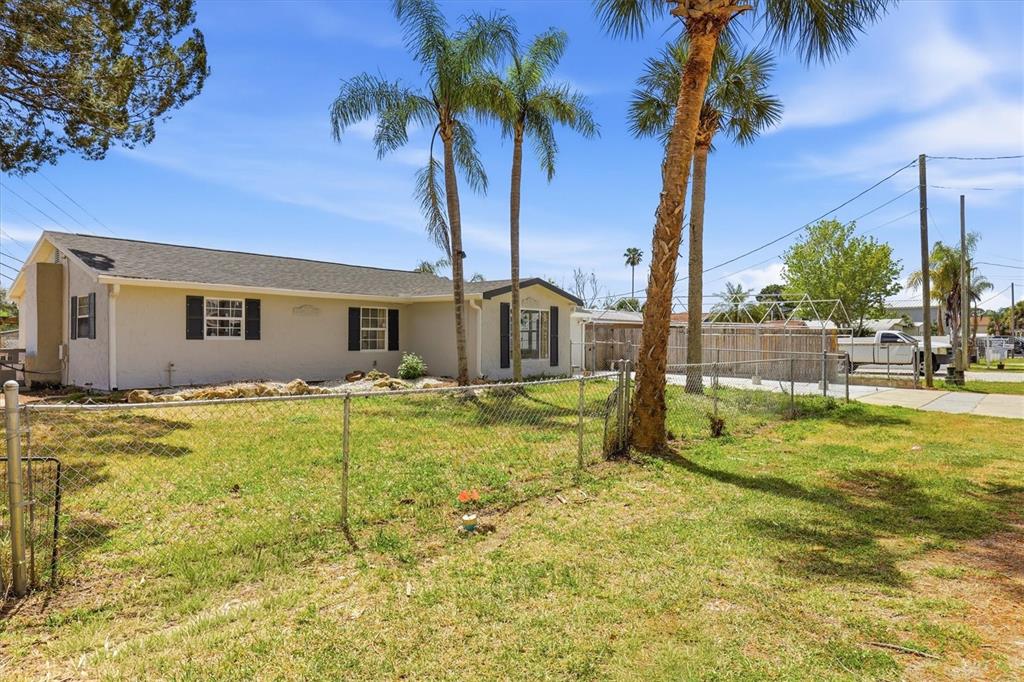 7114 Fair Lane Hudson, FL 34667 - Photo 58 of 59 a view of a house with a swimming pool