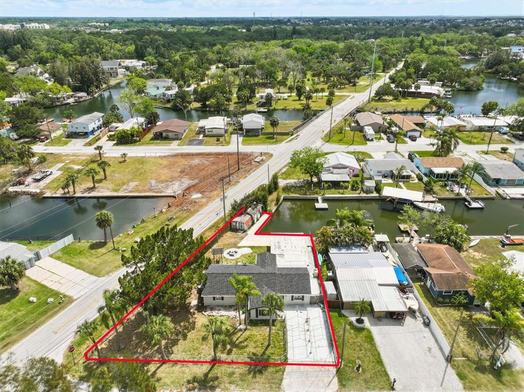 7114 Fair Lane Hudson, FL 34667 - Photo 10 of 59 an aerial view of residential houses with outdoor space