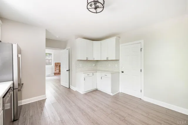 a white refrigerator freezer sitting inside of a kitchen
