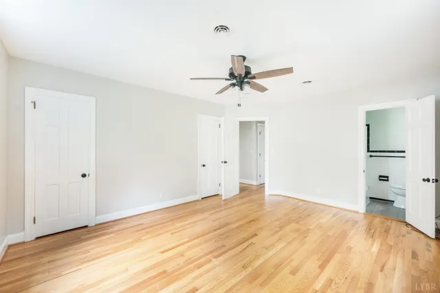 a bathroom with a toilet a sink and a window