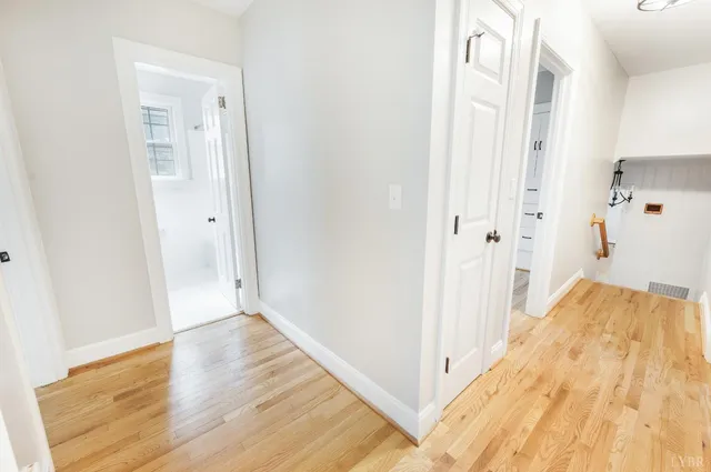 a view of a room with wooden floor