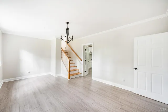 a view of an entryway with wooden floor