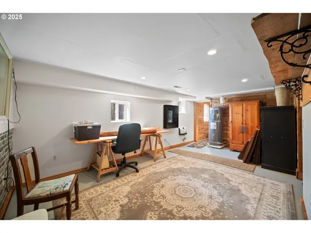 a bedroom with furniture and a window