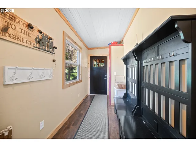a view of an entryway with wooden floor