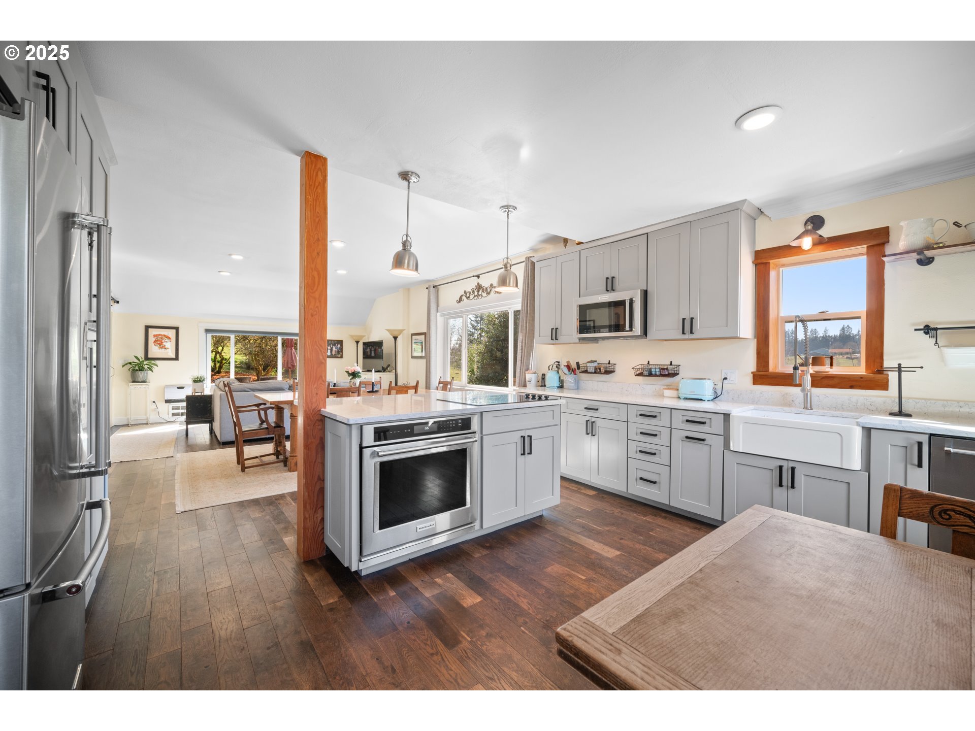 13505 Northeast Grantham Road La Center, WA 98629 - Photo 7 of 29 a open kitchen with cabinets a stove and a wooden floor