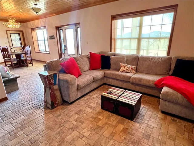 a living room with furniture window and couch