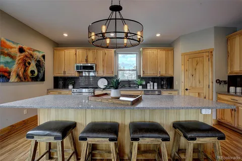 a kitchen with stainless steel appliances granite countertop counter space a sink and cabinets