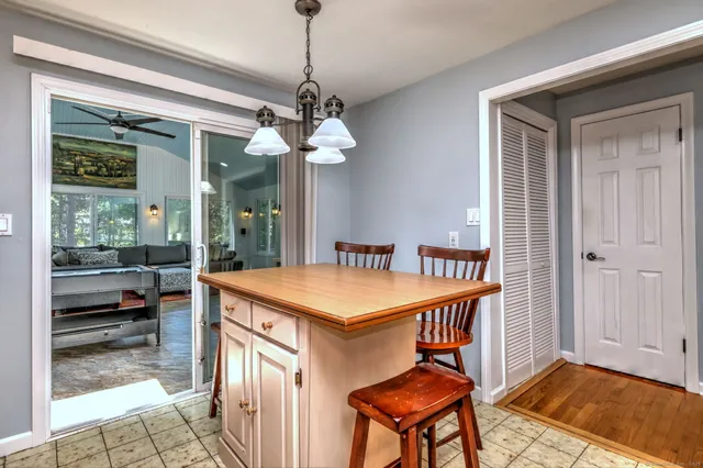 a very nice looking dining room with a table and chairs